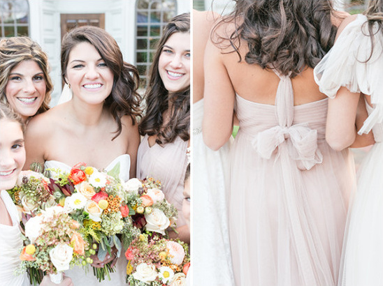 Bridesmaids in blush dresses with bouquets and a bow back