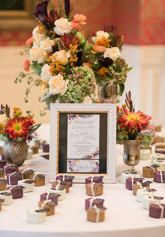 Wedding table setting with flowers invitation and gifts