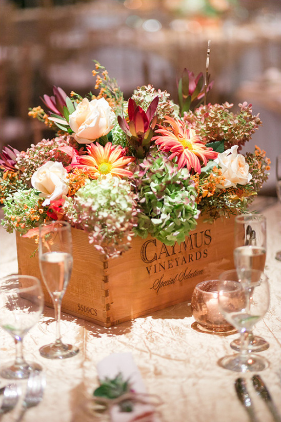 Elegant flower centerpiece in wine box at wedding table