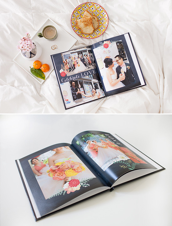 Open wedding photo album on a bed with flowers and food