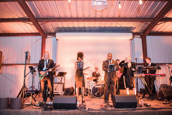 Live band performs on stage at a wedding reception