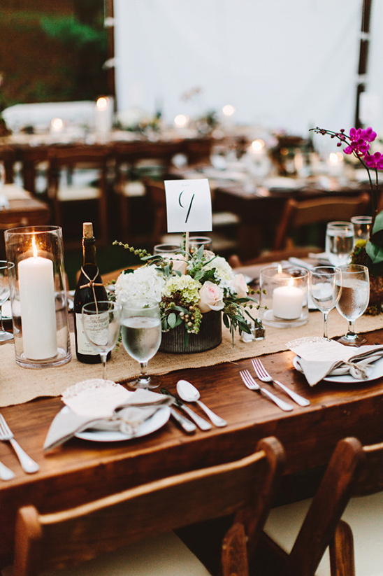 Rustic wedding table setting with floral centerpiece