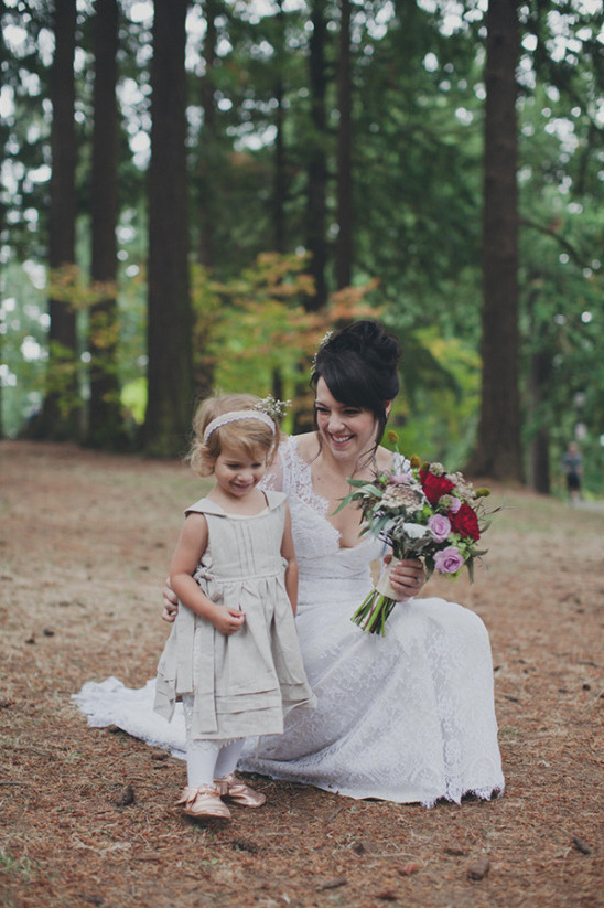 Bride and flower girl in a forest wedding