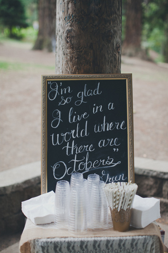 Autumnal quote chalkboard sign with cups and straws