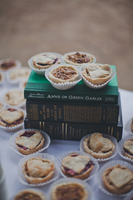 Mini heart and round pies atop books