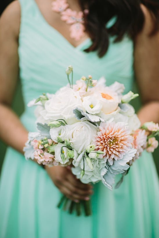 mint bridesmaid with white bouquet