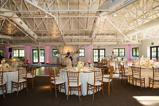 Elegant wedding reception venue with high ceilings and chandeliers