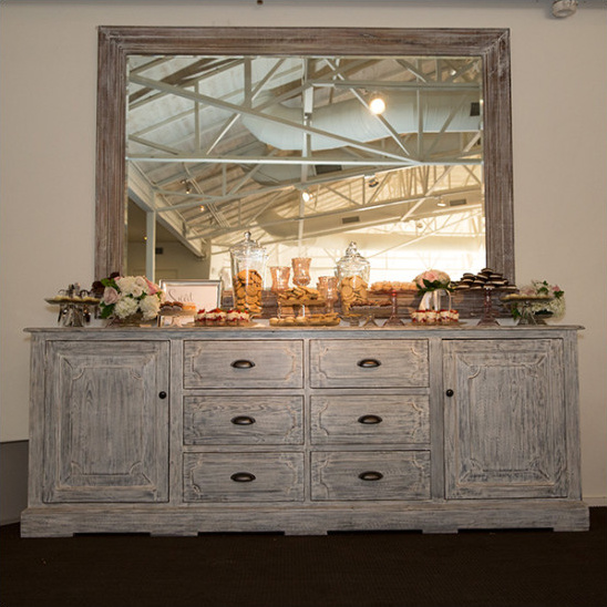 Rustic buffet with mirror and cookies dessert table