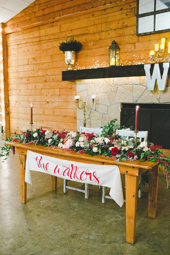 The Walkers wedding head table rustic wood and flowers