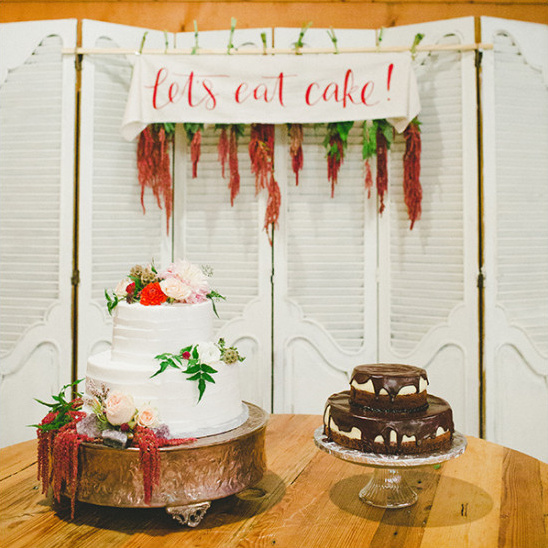 Elegant wedding cakes with Lets eat cake banner backdrop