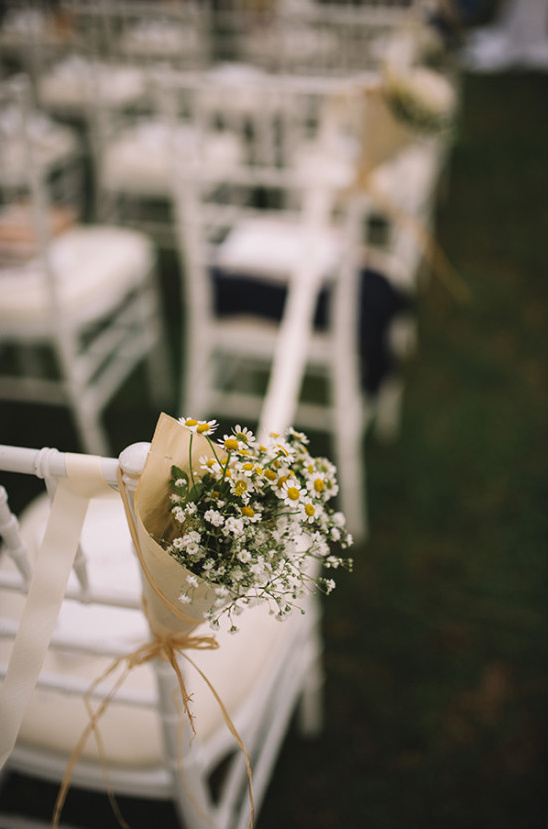 Ceremony aisle flower decor with daisies and babys breath