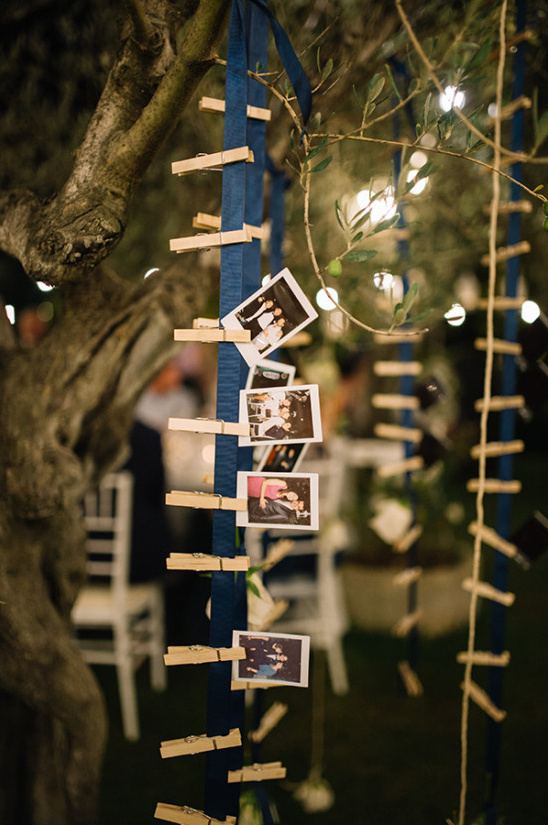 Wedding photos clipped to ribbon, outdoor decor