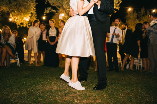 Bride and groom share first dance at outdoor reception