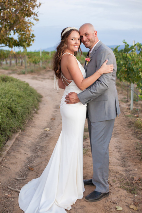 Bride and groom portrait in vineyard wedding venue