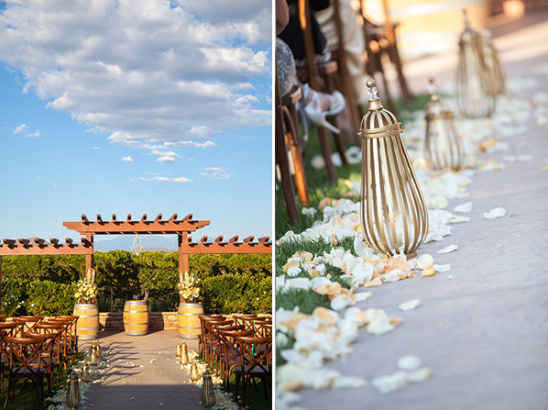 Outdoor wedding ceremony with barrels and petal aisle
