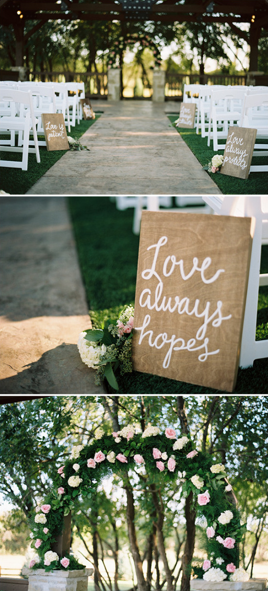 Rustic wedding ceremony decor with floral arch and Love Always Hopes sign