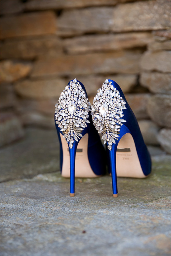 Blue satin heels with jeweled embellishments on heel