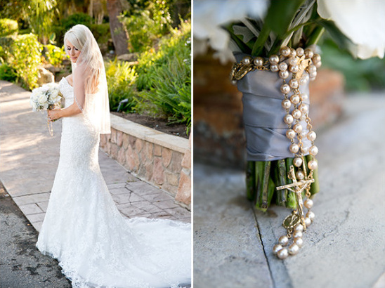 Bride in lace gown holding pearl rosary bouquet detail