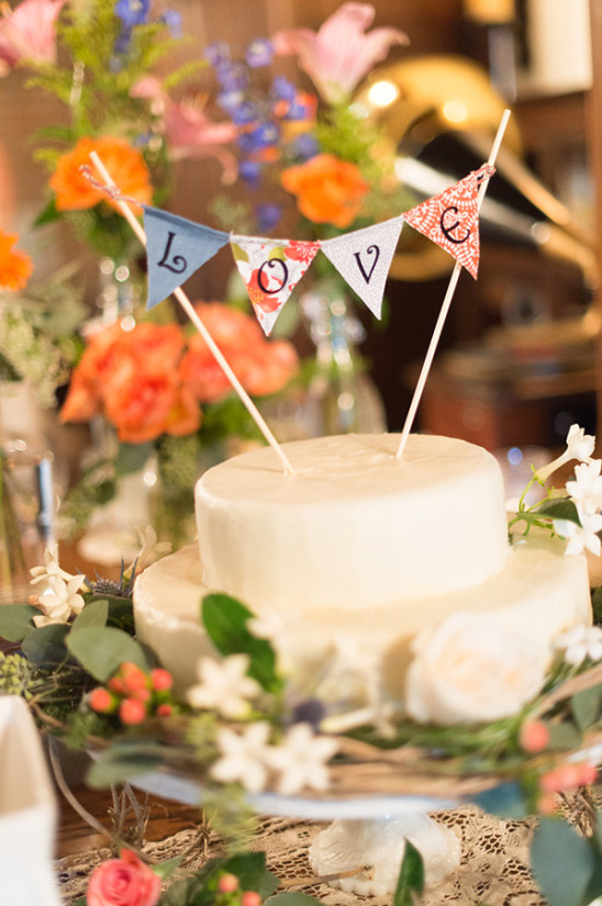 Rustic wedding cake with LOVE banner topper