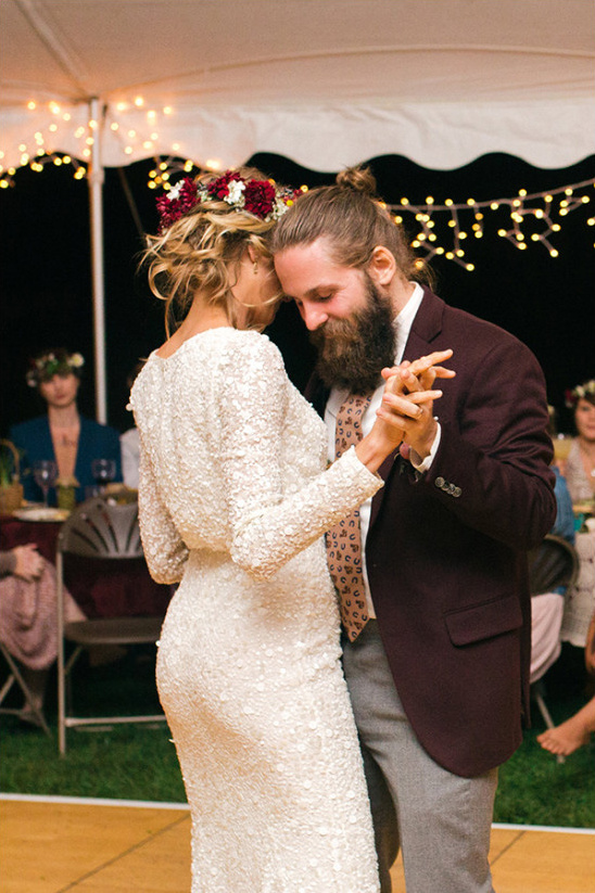 Bride and groom share first dance at outdoor wedding party