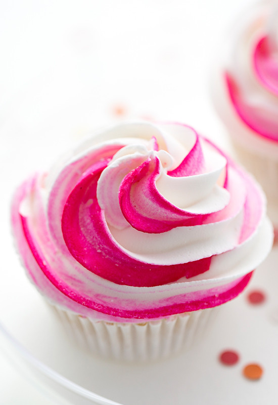 Pink and white frosted cupcake close up shot