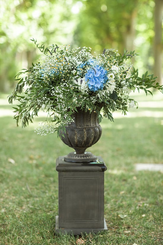 blue and white pedestal flower arrangement