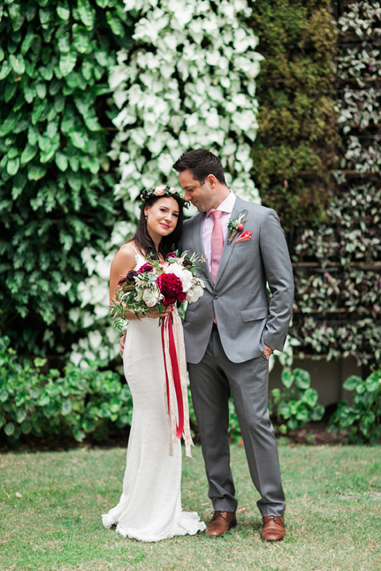 Garden wedding portrait of bride and groom smiling
