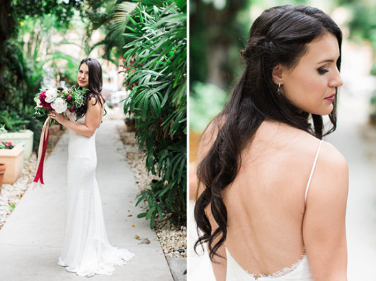 Bride in white dress holding bouquet on wedding day