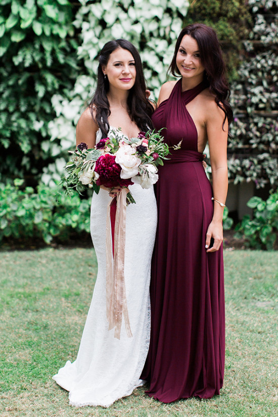 Bride and bridesmaid in red