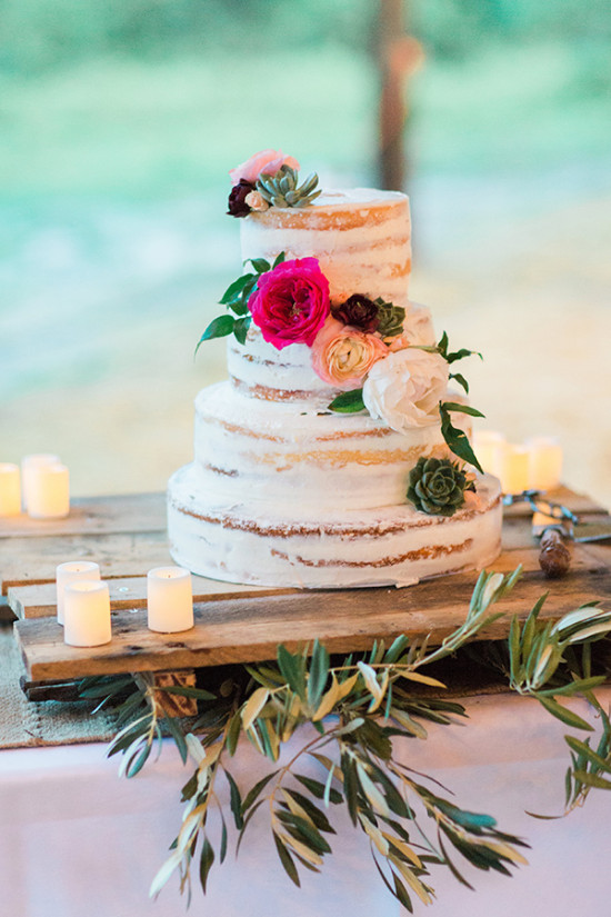 Naked wedding cake with pink peach and green