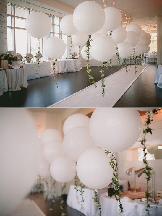 garland accented balloon aisle decor