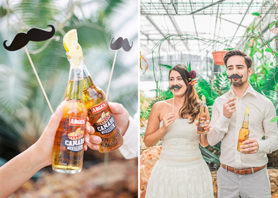 Couple with beer and mustaches celebrate the wedding day