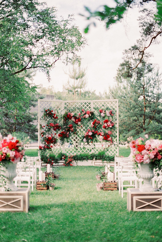 outdoor wedding ceremony in red and pink