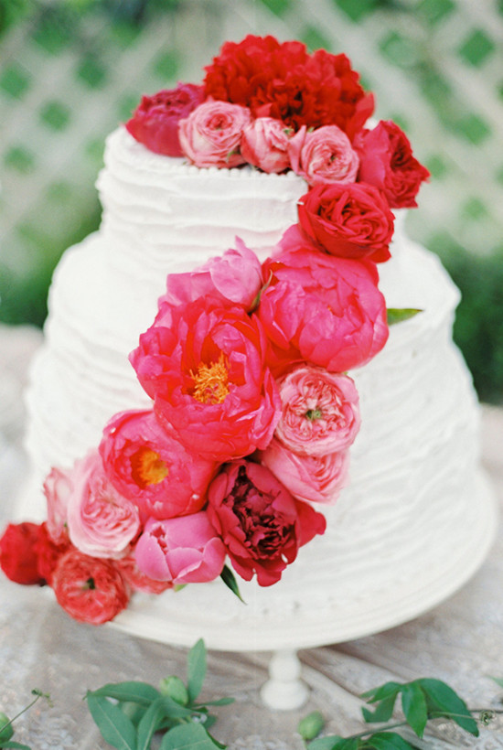 red flowe rtopped wedding cake