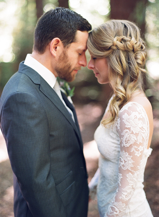 Loving wedding couple with foreheads touching in tender moment
