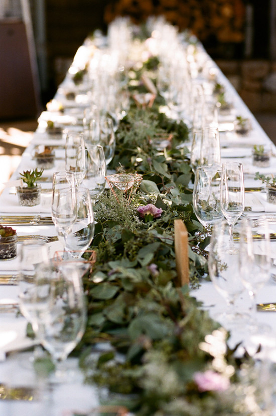 Elegant table setting with floral garland for a wedding reception