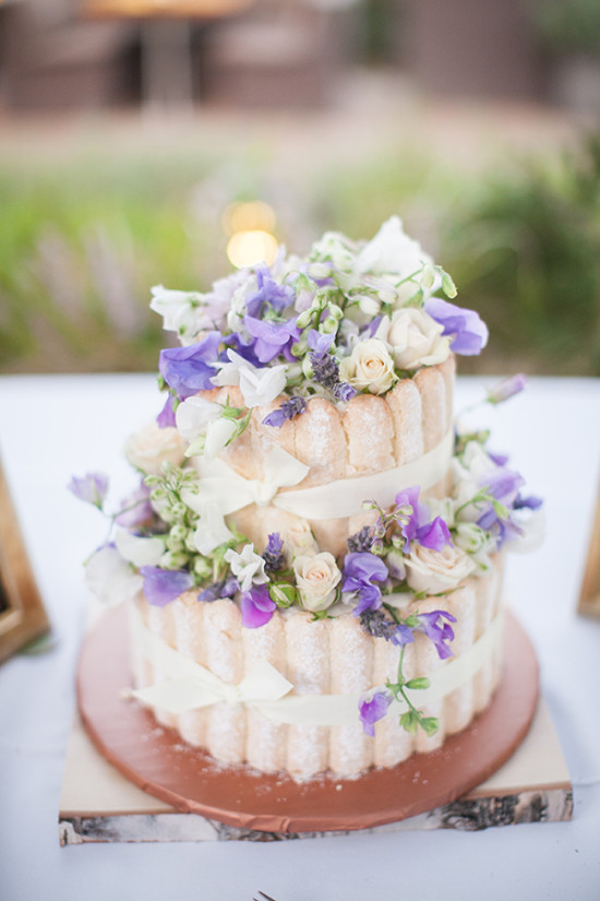 Elegant wedding cake adorned with flowers and ribbons
