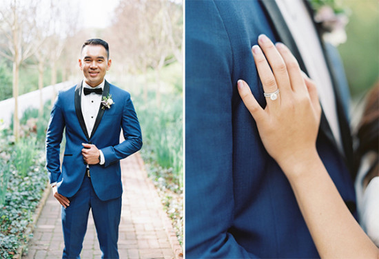 Groom in blue suit and bride's hand with wedding ring