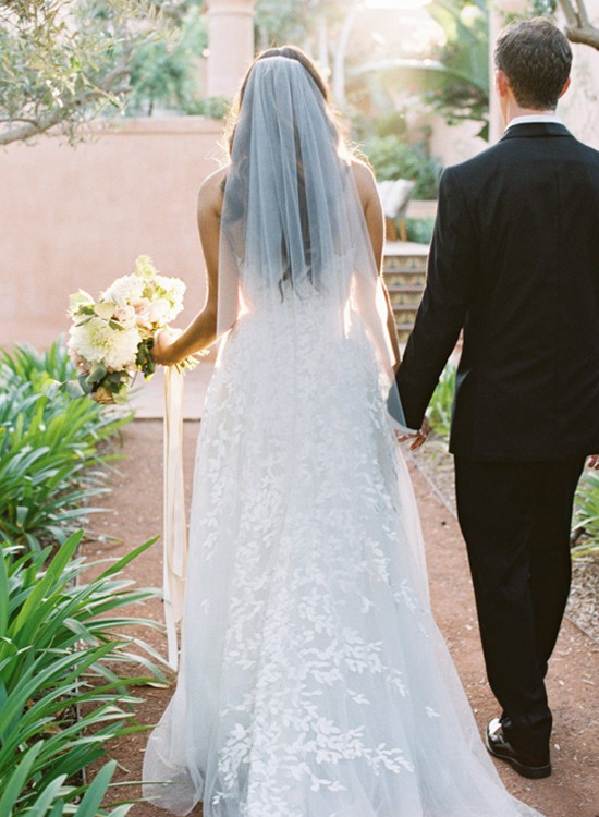 Bride and groom walking down aisle, wedding day
