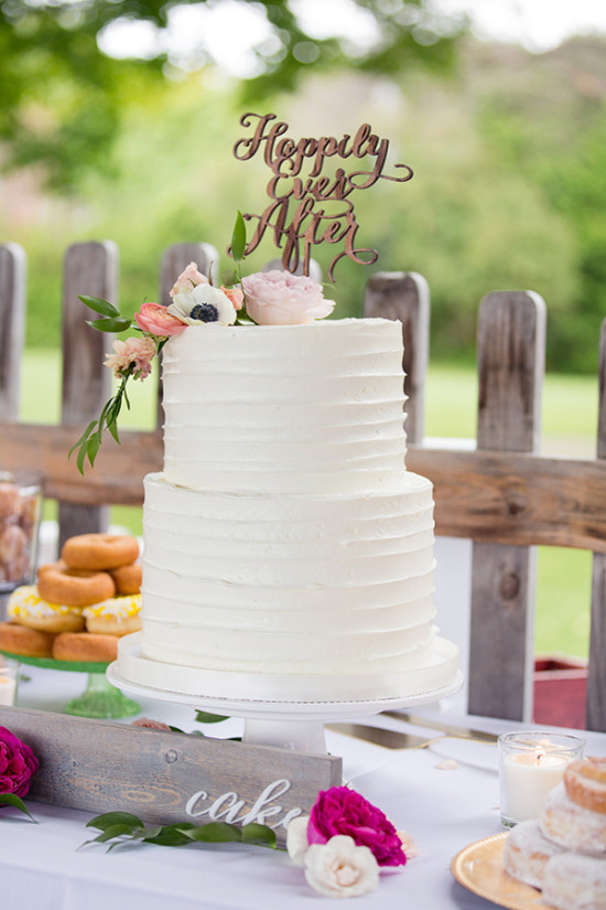 White wedding cake with wood topper