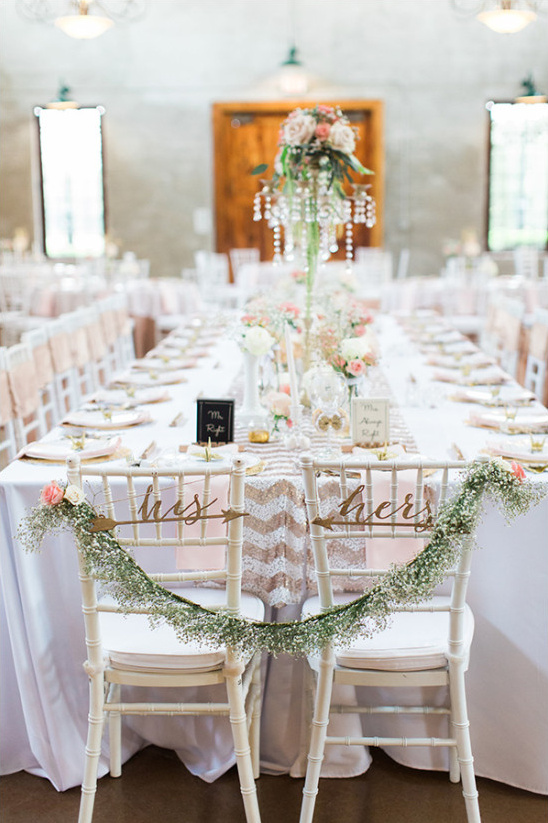 his and hers seats with babys breath garland