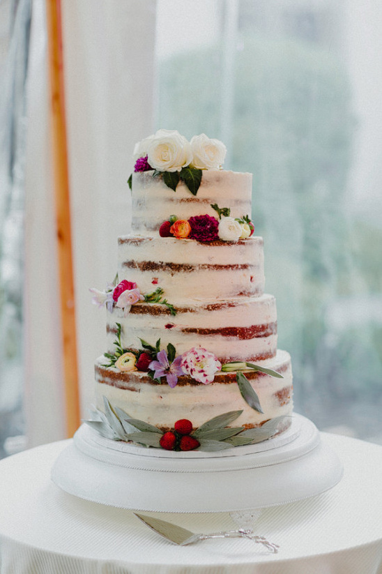 nearly naked flower topped wedding cake