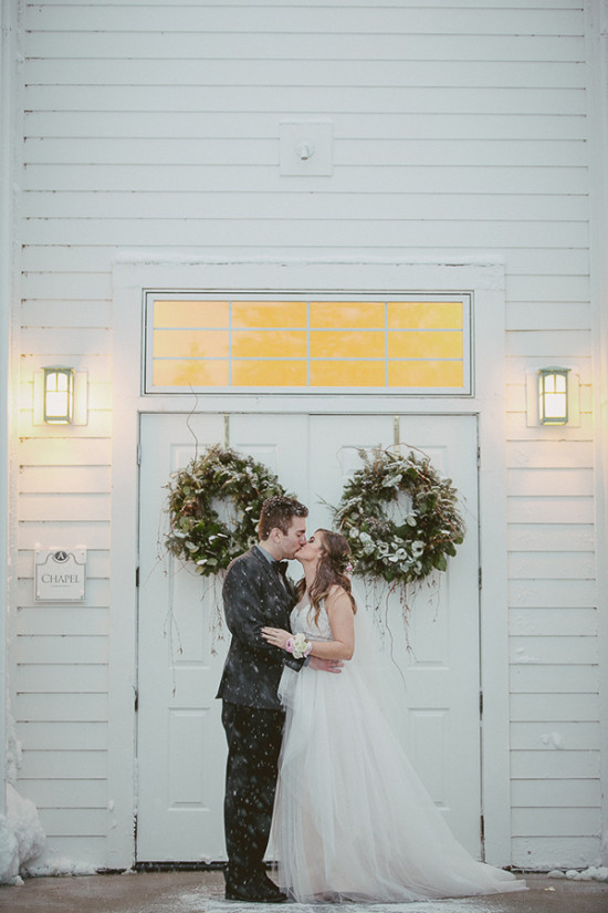 Romantic winter wedding at a snowy chapel