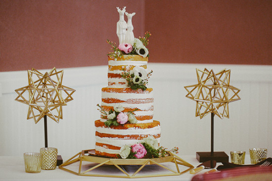 Naked wedding cake with deer topper