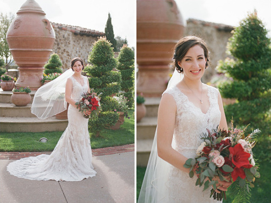 Bridal lace gown with red and blush bouquet