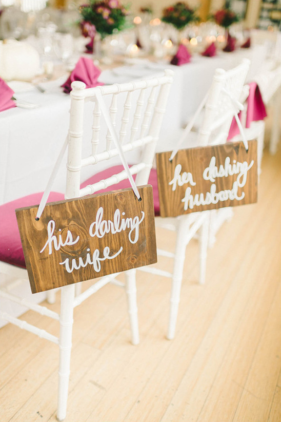 Wedding reception seating with his darling wife and her dashing husband signs