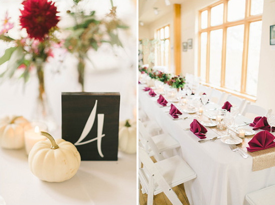 Elegant wedding table setting with fall-themed centerpieces and decor