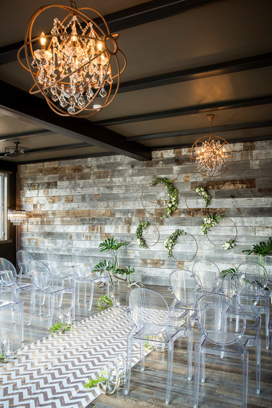 Modern rustic ceremony decor with reclaimed wood wall