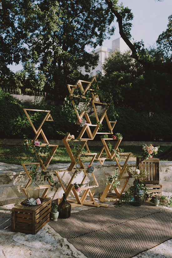 Geometric ceremony arch with florals