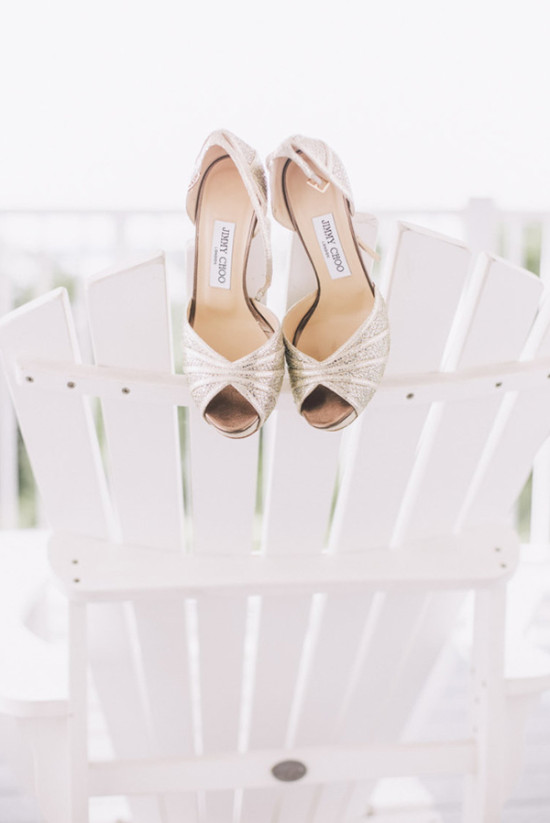 Elegant Jimmy Choo wedding heels on a white wooden chair